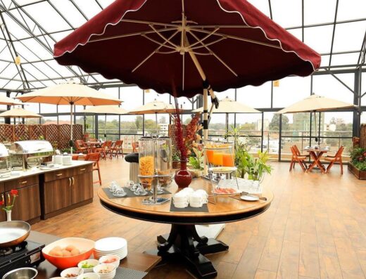 An image showing interior views of Lotos Inn & Suites Hotel