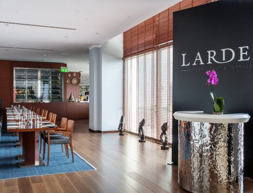 An image showing The Larder Restaurant & Terrace hotel signage