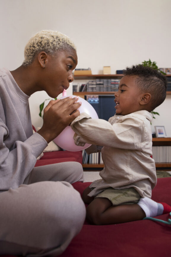 An image of a nanny playing with a kid