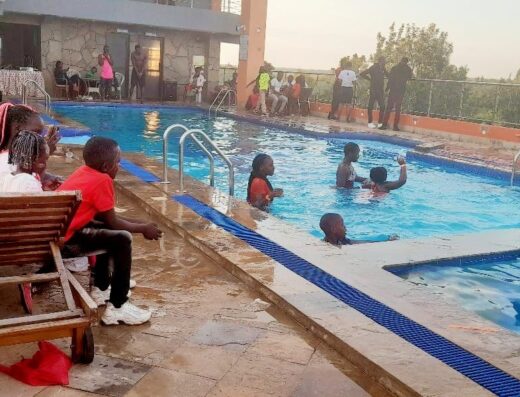 An image showing people by the pool at The HydeOut Riviera