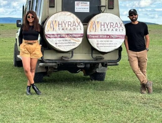 Hyrax Safaris showing tourists posing for a picture at the back of the company's vehicle