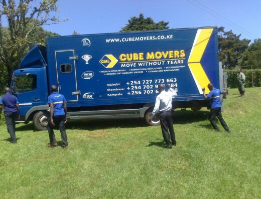 Cube Movers Limited showing its vehicle and some of the staffs